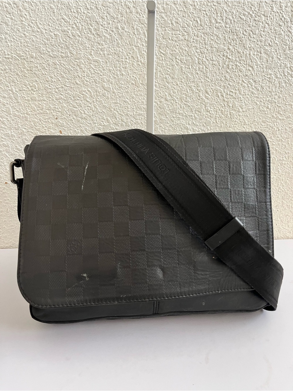 Louis Vuitton leather messenger bag